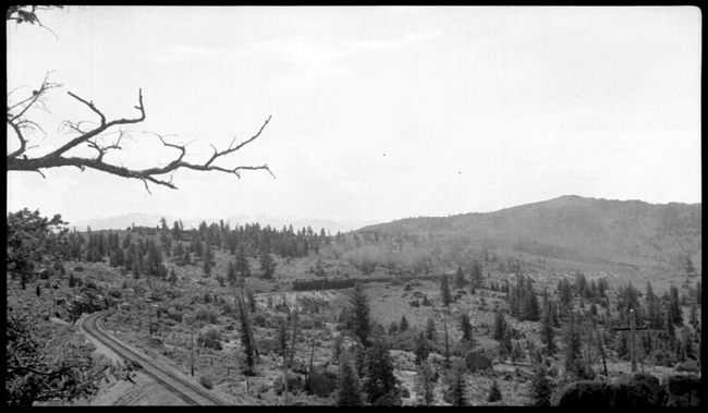 NP 1761, Class W-3 and NP 2235, Class Q-5 doubleheading with train No.1 approaching Welch on Butte Mountain 