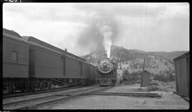 NP 1741, Class W-3 and NP 2652, Class A-2 with first No. 1, meeting Train No. 236 on siding at Welch