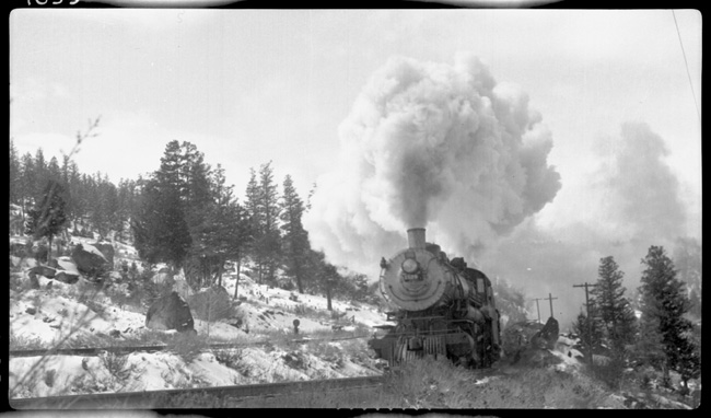NP 1529, Class W and NP 2656, Class A-2 doubleheading with train No. 1 passing Welch