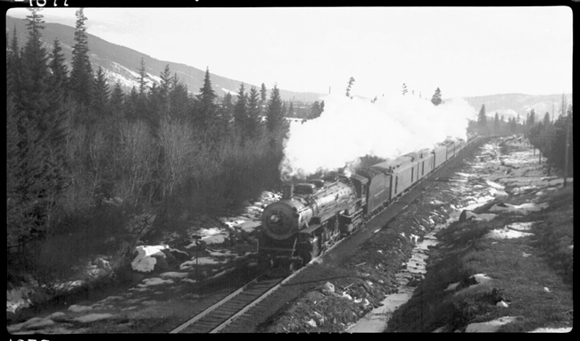 NP 2611, Class A with Train No. 1 descending Evaro Hill. This photograph was taken from Highway overpass between Evaro and Arlee