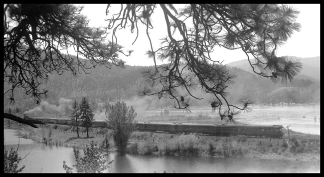 NP 2241, Class Q-5, with Train No. 1 along Clarks Forks River east of Plains, MT