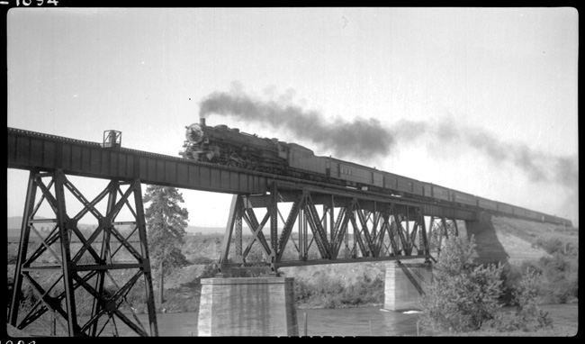 NP 2607, Class A with Train No. 2 crossing the Spokane River near Irvin, WA.