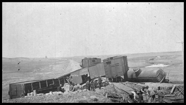 Different view of Train wreck near Dodge, ND.  End door box car in picture is NP47083. 