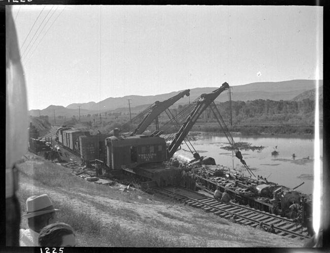 Engleside Spur derailment of  NP 2655, Class A-2 and Train X2655E/652's which derailed because of washout due to cloudburst. View two wreckers lifting on derailed 2655.