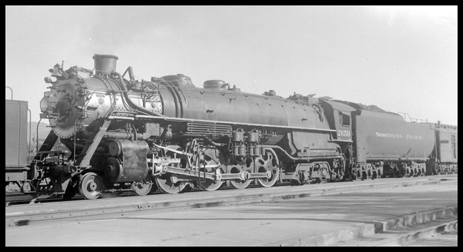 NP 2650, Class A-2 blue flagged on passenger train at Livingston.