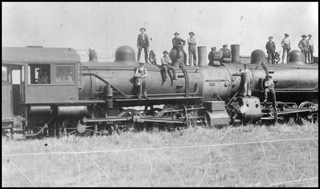 Head-on Collision of NP 124, Class S-2c and NP 117, Class S-2c near Sweet Briar, ND. Lots of people standing on engines posing for camera.