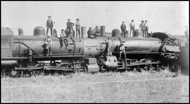 Head-on Collision of NP 124, Class S-2c and NP 117, Class S-2c near Sweet Briar, ND. Lots of people standing on engines posing for camera.