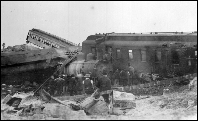 Passenger train pulled by NP 2128, Class Q-1 wrecked at Allard, MT in November 1908. Many by-standers watching after the accident.  Four were killed and 20 injured.