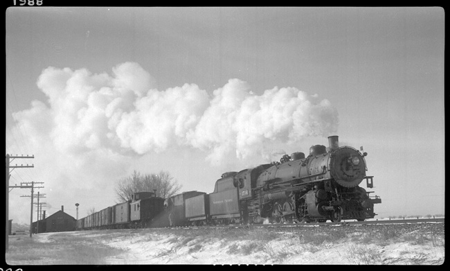 Train No. 603, with NP 1750, Class W-3, meeting Train No. 602, with NP 1716, Class W-3.  Temperature is 20 degrees below.  Train 602's Engr. Diercks and Condr. St Cyr and train 603's Engr. Benson, and Condr. Robinson.  Train 603 was 43L - 17E -with 2100 Trailing tons.