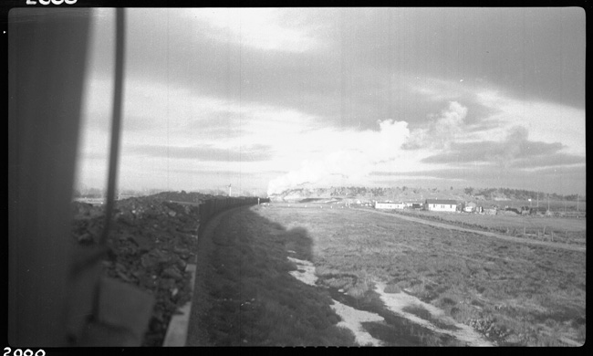 X1750E, NP 1750, Class W-3, pulling 46L - 0E -4216 tons of Company Coal.  Engr. Murphy, Condr. Elden leaving Forsyth, taken from caboose.
