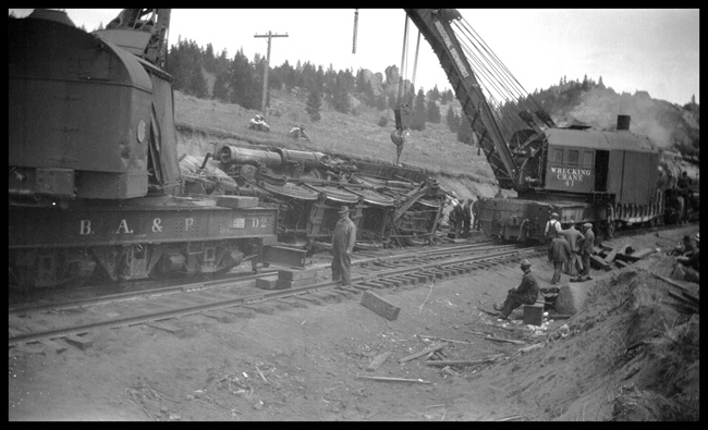 Wreck of NP 2215, Class Q-4, light engine West, with Engr. Adams and work X1562, Class W, at Homestake, MT, May 1930.  Two wreckers working the accident, BAP D-2 out of Butte and NP 41 out of Livingston. 
