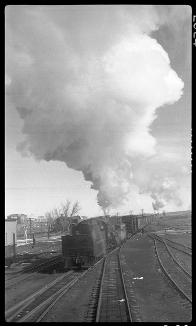 NP 2502, Class W-4 former number 2323,  Rebuilt at Brainerd 1918-1919, helping X5011E leave Glendive.  