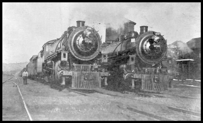 NP 1732 and NP 1733, both Class W-3's on X1732W and X1733W at Austin, MT.  On-looker to side of left locomotive. 