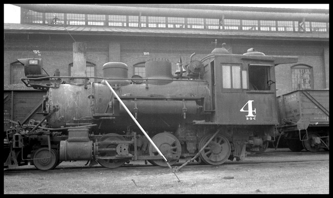 C&S, 2-6-0 narrow gauge at Denver, CO probably C&S Roundhouse.  Locomotive is standing without tender. 