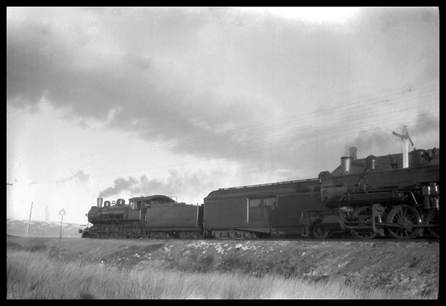 CB&Q trains at Frannie, WY.  One train is a passenger train with the locomotive of a second train on an adjacent track.  Locomotive numbers are reported as 2808 and 2004.