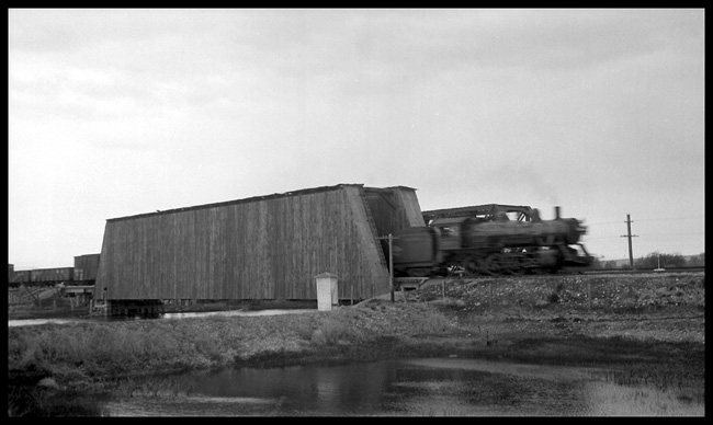 MILW freight train on Gallatin Valley branch crossing bridge over Madison River at Three Forks, MT