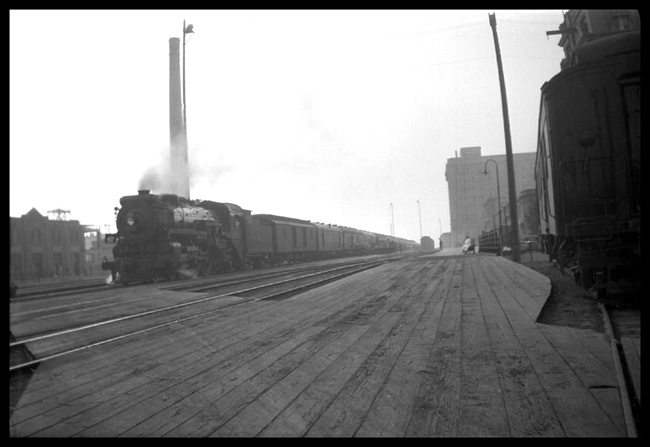 Approaching Calgary and a long stop, a 2700 Pacific brings local 2 into the city