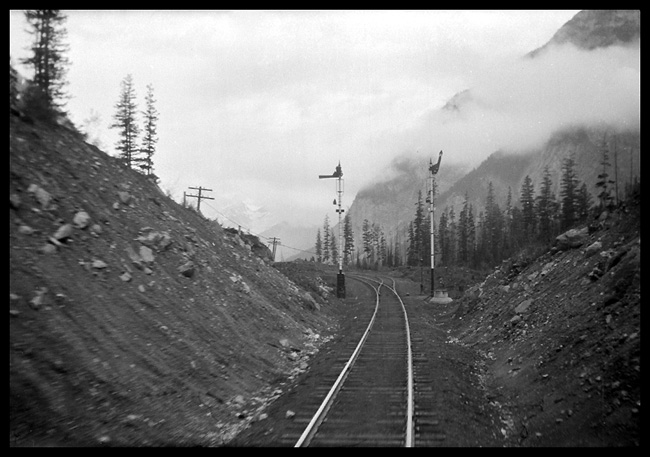 The riders on the back platform of the Imperial see ABS at work, as the semaphor blade drops top horizontal, protecting us to the rear through another block in the BC mountains