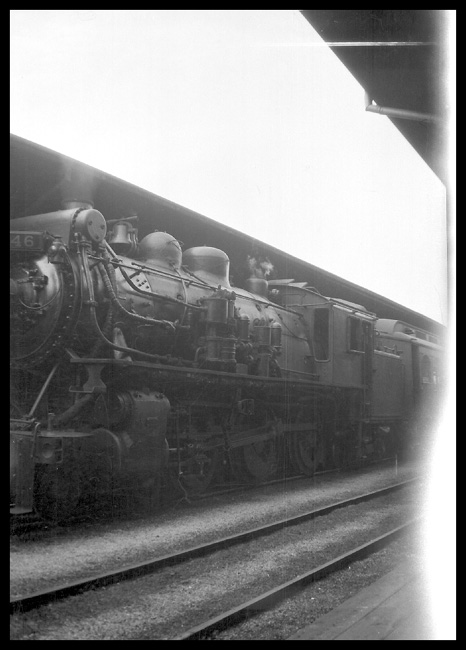 A hasty shot from aboard an arriving train captures a 4-6-4T, one of 5 on the CNR, waiting to depart Montreal on a commuter train.
