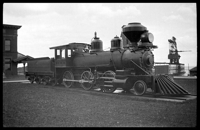 The Three Spot was one of the first steam locomotives placed on public display.  It still sits beside the passenger station, now used by the North Shore Scenic Line.  Today it keeps company with an ore car and a caboose of equal vintage.  The engine was built by Baldwin in 1883.