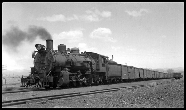 There never was a lot of traffic on the leg of the narrow guage circle that connected Salida with Alamosa, but sometimes there would be enough to justify an extra.  Ronald Nixon would spend a day following this freight south along a very lonely track