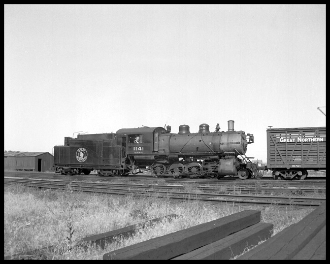 GN 1141  Kalispell,  Mont. GN class F-7 2-8-0  Glacier paint  Switching GN stock car  Switcher pilot