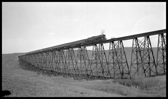 GN Train No. 2  257? on trestle west of Minot, ND GN class S-2  4-8-4  Baldwin 1930  Engine and entire psgr train are in view on long steel trestle. 
