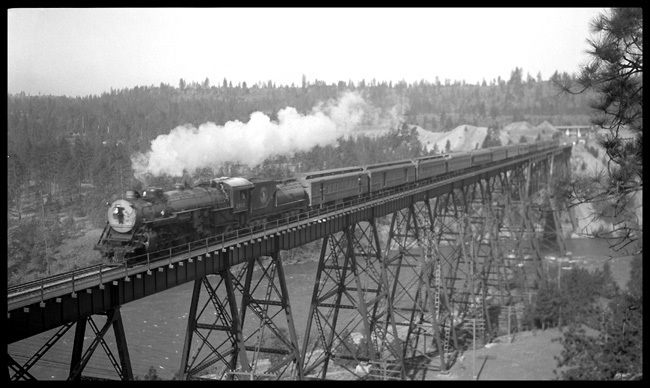 GN #2 on trestle west of Spokane  eng 2502  7/37 GN class P-2  4-8-2 Baldwin 1930 and entire train on steel trestle across the Spokane River  Ahead is Fort Wright Junction, where the GN turns north and the SP&S turns south  Exceptional LF high angle view