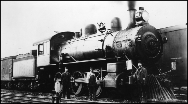 NP 179, Class Rc with crew standing in front of locomotive.