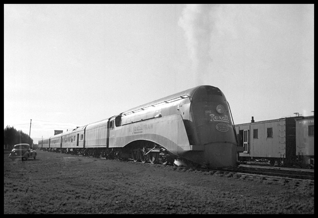 NYC X2847W at Whitehall  6/36 RF view of Rexall Streamliner demonstration train  Outfit cars in left bkgrnd  Automobile [Nixon's] in right bkgrnd  See RVN03673,5,6