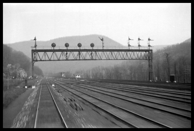 View of 8-track PRR siginal bridge from rear of train at speed between Altoona and Harrisburg, PA.
