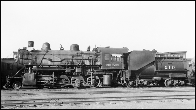 UP 210, 2-8-0 in freight yard at Denver.                                                                                                                                 