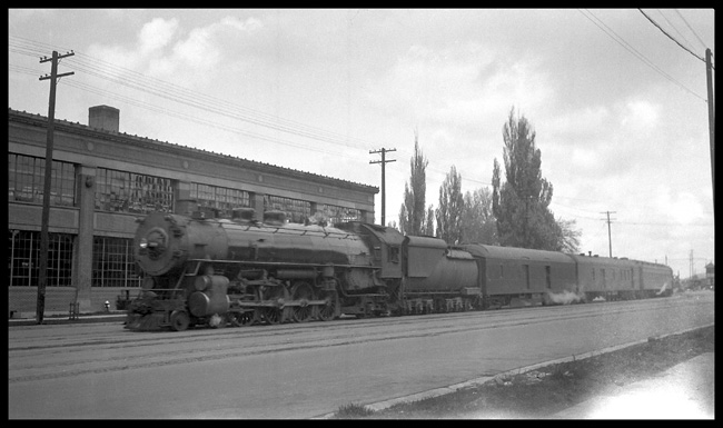 UP Passenger train No.7 leaving Salt Lake City, UT. Behind 4-8-2 Mountain type Eng. On May -8 1933.