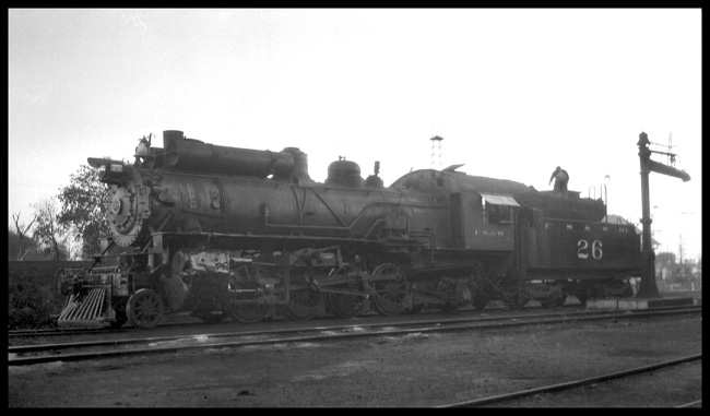 2-8-2 No.26 taking water, Note air tanks between bell and sand dome.
