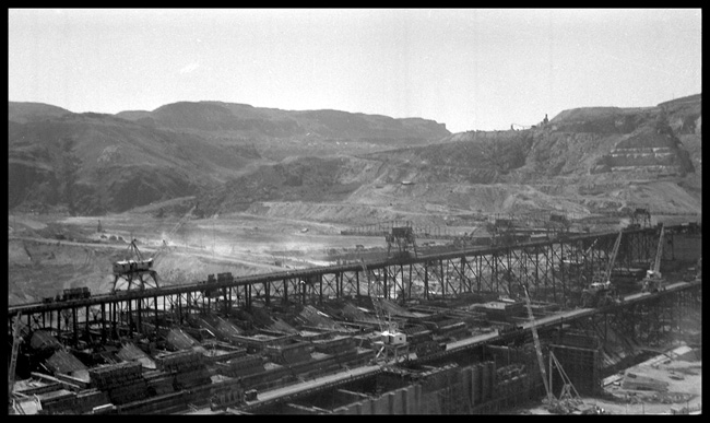 Grand Coulee Dam  Washington Pan view of Grand Coulee Dam being constructed across the Columbia River, from different angle