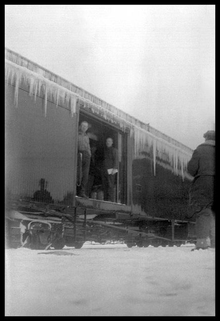 NP  Gardiner Mont  WH  1926 View of three persons in door of icecicle-covered baggage car, one of whom may be 