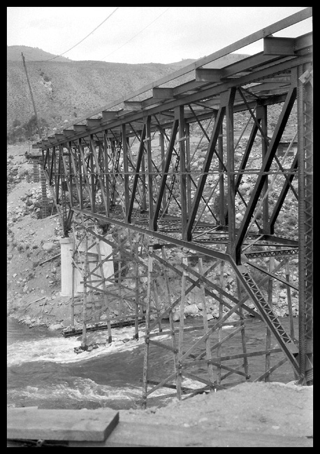 NP  Gardiner Mont  New bridge over YStone   1930 View along most of the length of this steel truss highway bridge, shot from the level of the bottom of the steel truss work