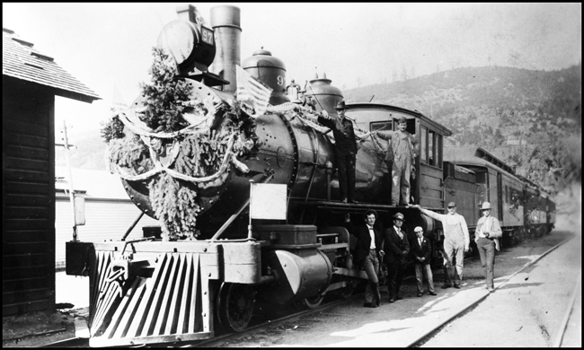 NP 97, Class F locomotive on Special Train at Marysville, MT.  Crew and passengers posing beside locomotive.