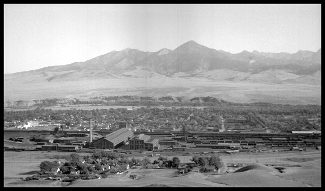 Livingston Mont  5/33 Fantastic panoramic view of Livingston backshop, roundhouse and yard shot from the hill to the north, looking south  Mountains in background