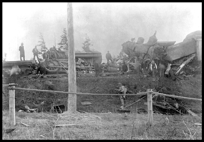 NP wreck  716 - 424  head-on  #12 and lite eng.  Baxter  Minn  10/22/02  cy  WRM View looking up an embankment at wreckage, being crawled over by a number of people. 4-4-0 716 is on the left, and was the power on psgr train #12  424 is a low drivered 2-6-0 Copy negative from Warren McGee  
