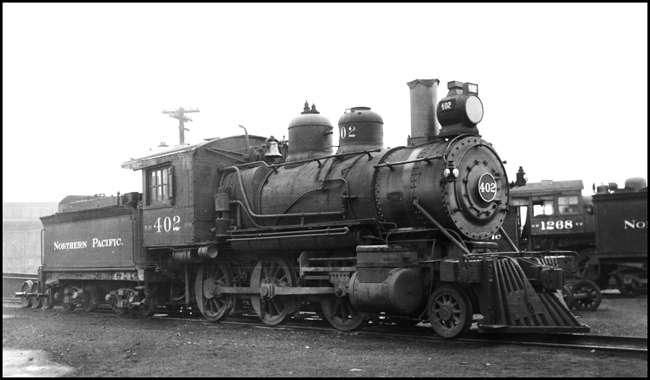 NP 402, Class D-6 locomotive on storage track at Pasco Roundhouse. Former number NP 65.  NP 1268 sitting on adjacent track.