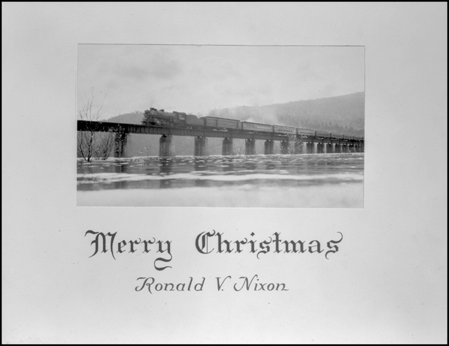 Ron Nixon's Christmas card Undated Christmas card, with photo of NP psgr train on NP bridge at Sand Point, ID