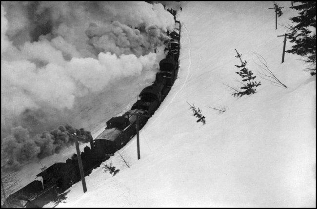 Plowing out Wallace branch  1915-1916  Engs 1223 1217 1310 1319 74 3102  Orig Cuplin from G  B  Noll    The exact location is not given, but there are several places on the 4% grade over Lookout Pass where lower level track can be observed from higher level track