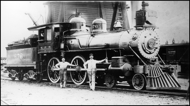 NP 676, Class C-19 locomotive, with proud crew posing by spiffy NP 4-4-0 no. 676 at Missoula.