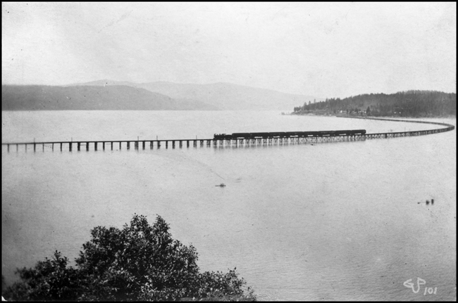 NP psgr train on old Pend d'Oreille Lake Bridge  Sand Point about 1902  cy R Beebe  The scan is poor, but there may be a swing bridge at the far right end of the bridge
