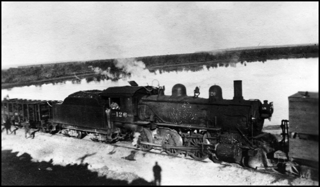 NP 126, Class Sc2 in the middle of freight cars on the Dakota Div. about 1913.