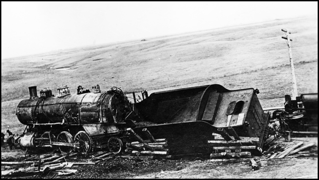 Wreck remains of NP 2351, Class T locomotive and another locomotive which must have been in passenger service. Appears this may have been a side swipe collision between Bloom and Jamestown, ND.