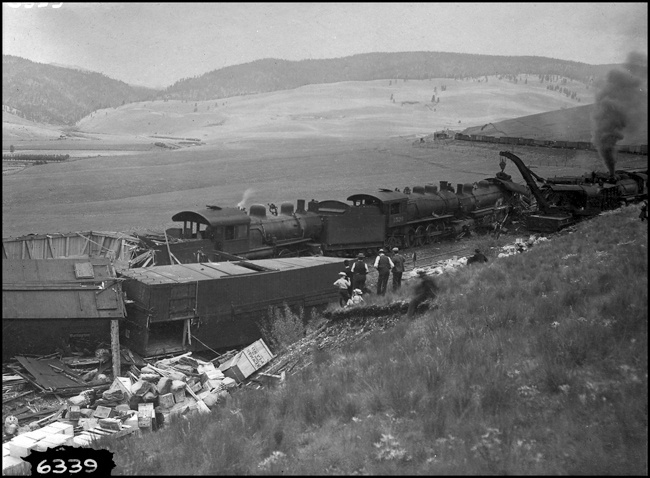 NP wreck between DeSmet and Nagos about 1906  Engines 1526-1300-?  DGK copy negative  The location is about where the grade begins on the east side of Evaro Hill, on the 