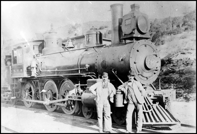 NP 397, Class E locomotive at Fargo with engine crew posing for photograph.