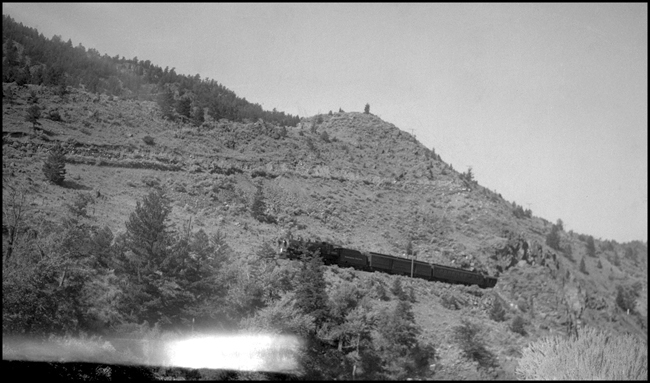 NP 217-1529  Near Sphinx  9/12/40  This view is of NP's passenger train from Livingston MT to the entrance to Yellowstone National Park at Gardiner  MT  1529 is a class W  2-8-2 built by ALCO in 1905 at their Brooks works  It is an oil burner, unusual on the Rocky Mountain Division, but deemed less conducive to fire setting than a coal-fired engine, a major consideration that close to Yellowstone Park  When the tourist season was over and wet weather returned to the area, 1529 would be transfered out to the Tacoma Division, where it saw service on the Grays Harbor branch  This was a recurring cycle of service for 1529  
